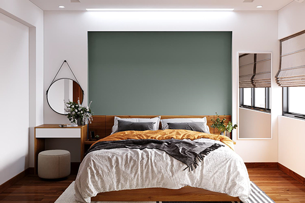 Mảng tường sát đầu giường được thiết kế lõm vào, sơn xám thanh lịch tạo thành điểm nhấn nổi bật, thu hút giữa tông nền trắng thanh thuần