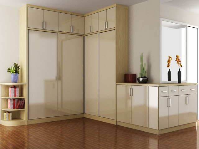 Tủ quần áo chữ L cao kịch trần kết hợp với chiếc tủ ngang mang lại sự đồng nhất, gọn gàng cho căn phòng.