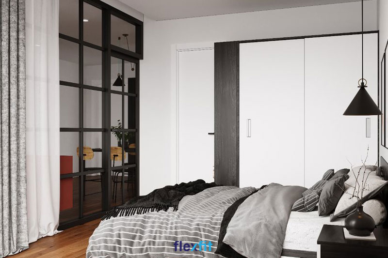 Mẫu tủ quần áo 2m có thiết kế tối giản, tinh tế, sử dụng 2 tông màu cơ bản là trắng và đen vân gỗ, đồng bộ với phong cách nội thất chung của không gian phòng ngủ. Tủ có kích thước nhỏ gọn, sử dụng cánh lùa tiện lợi, tiết kiệm diện tích.