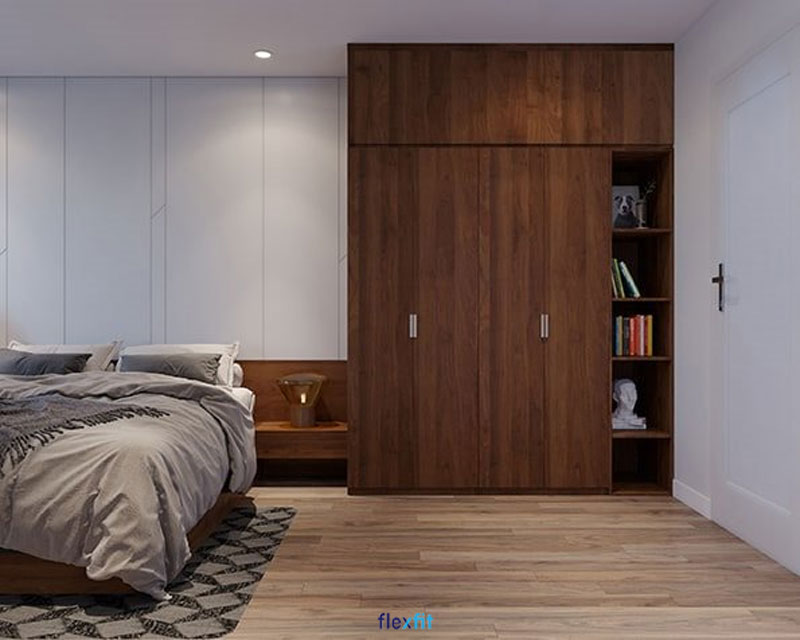Mang đậm phong cách Bắc Âu cổ điển, với màu vân gỗ trầm, tủ quần áo 4 cánh 3m này mang lại sự ấm cúng, sang trọng cho căn phòng. Phần kệ sách được bố trí ngoài không chỉ tiện lợi mà còn giúp tăng tính thẩm mỹ cho căn phòng.