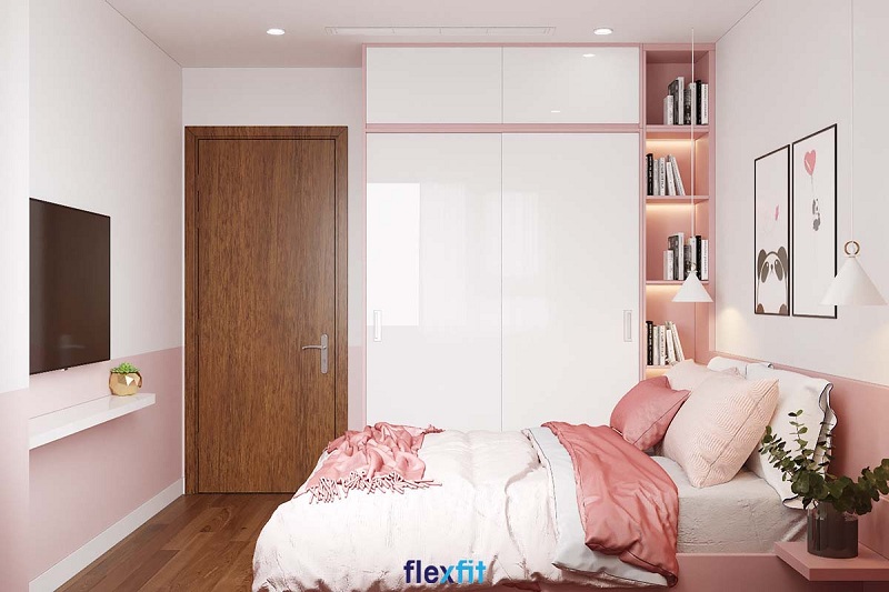 Tủ quần áo 2 cánh 2 buồng pha phối hai màu trắng và hồng pastel cho căn phòng tràn đầy sự ngọt ngào. Việc kết hợp tủ với giá sách giúp chủ nhân tìm chọn cuốn sách mình yêu thích để đọc thật dễ dàng.