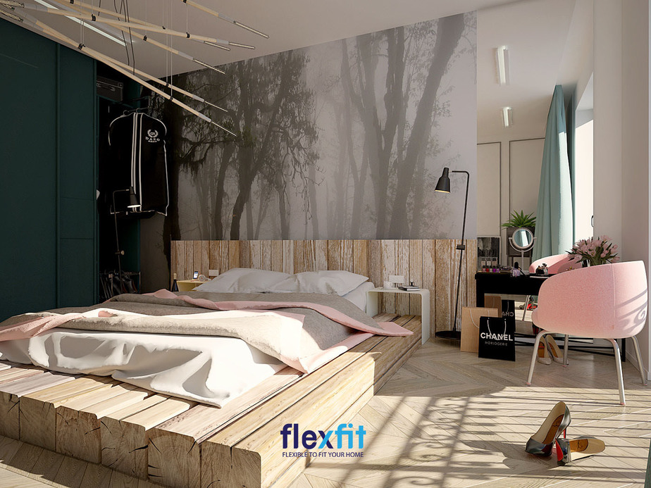 Chiếc giường ngủ bằng gỗ mộc đặt lên tấm đệm cùng bức tranh lớn đầu giường giúp căn phòng của nữ chủ nhân trở nên vô cùng phong cách